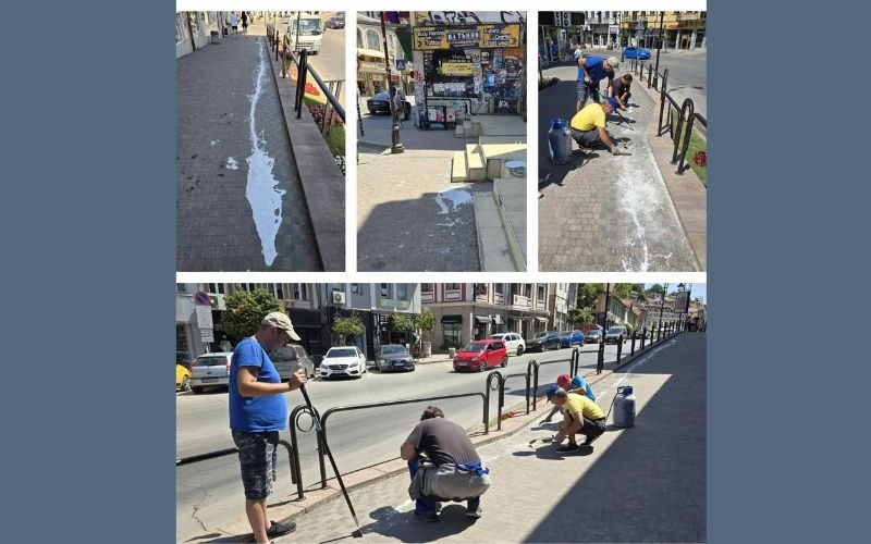 Заловиха мъж, заливал с бяла боя тротоар в центъра на Велико Търново (СНИМКИ/ВИДЕО)
