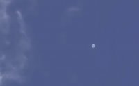 Загадъчно бяло кълбо в небето на Япония. НЛО ли е?