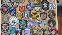 снимка 4 Полицай събира фуражки от цял свят, подреди изложба