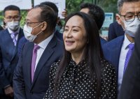 Дъщерята на основателя на "Хуауей" се върна в Китай