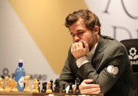 Магнус Карлсен с победа в мача за световната титла по шахмат