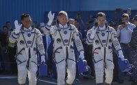 Руско-американски екипаж потегля към Международната космическа станция (Снимки)