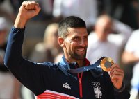 снимка 2 Новак Джокович добави и златен медал от олимпийски игри към списъка си с трофеи
